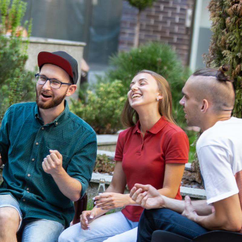 three young people laughing