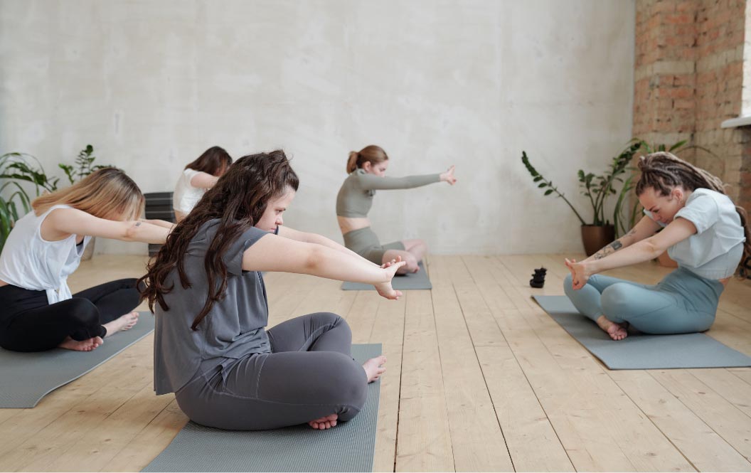 young women doing yoga